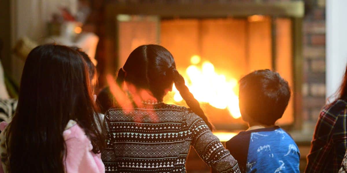 Kids enjoying a clean fireplace kept safe and clean by A Noble Sweep