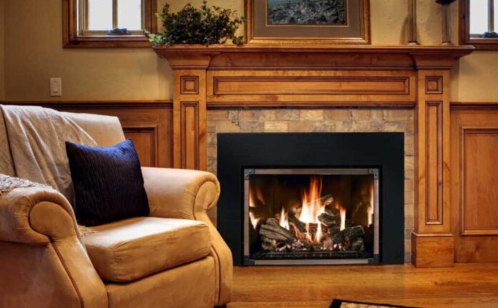 Cozy living room with a modern fireplace insert installed in a traditional wood mantel, showcasing energy-efficient home heating in a classic New Orleans-style interior.