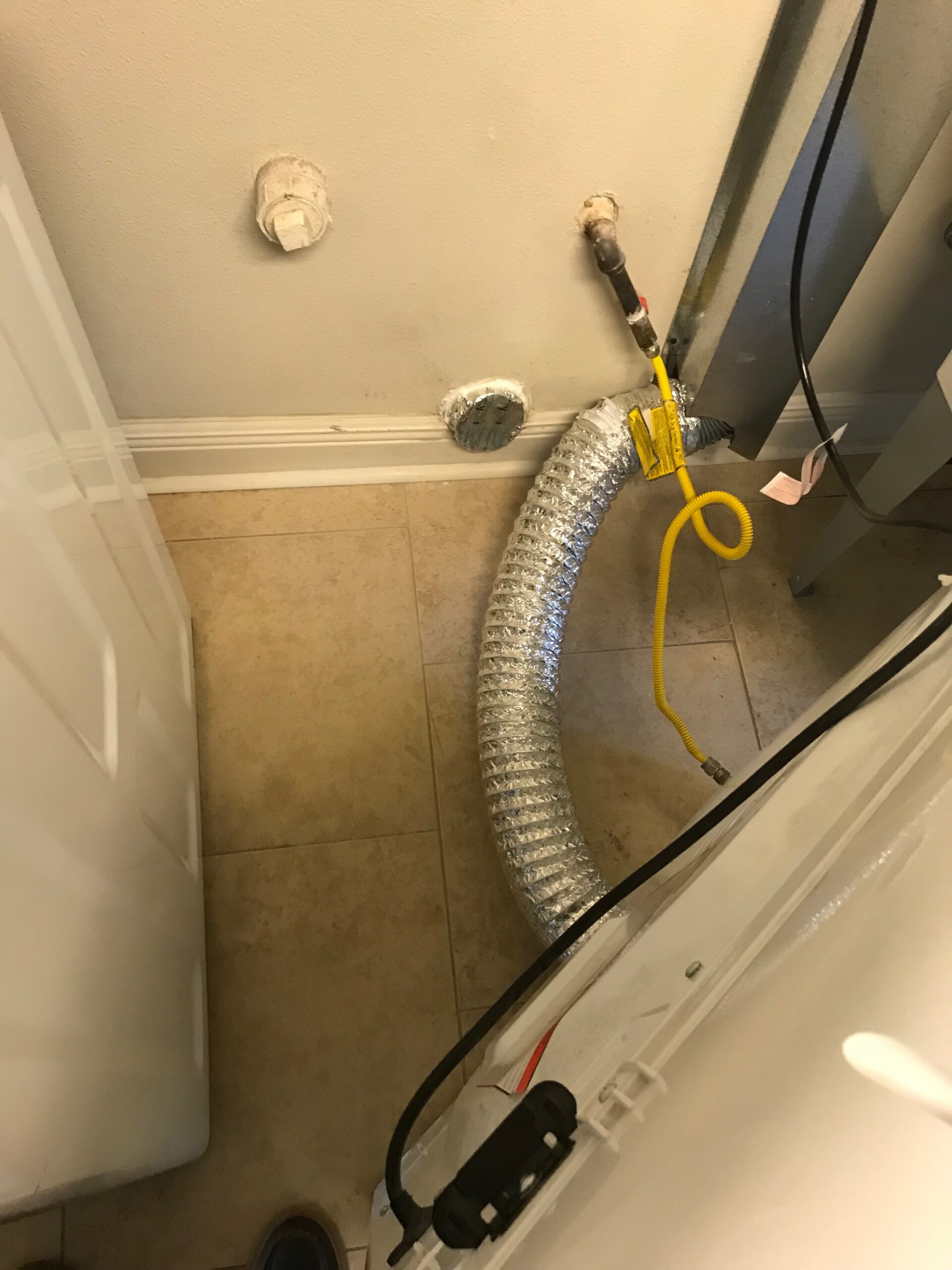 A Noble Sweep certified dryer vent technician working in St. Tammany Parish